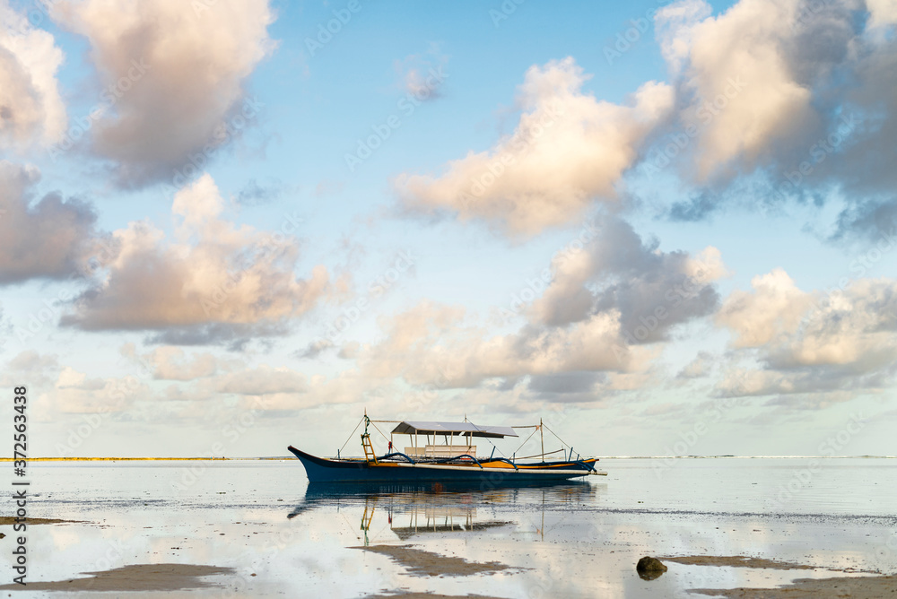 Philippines, Siargao, General Luna, Fishing boat on sea at sunset Philippines, Siargao, General Luna, Fishing boat on sea at sunset