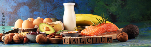 Best Calcium Rich Foods Sources. Healthy eating. Foods rich in calcium such as bean, almonds, hazelnuts, spinach leaves, cheese, and fresh milk photo