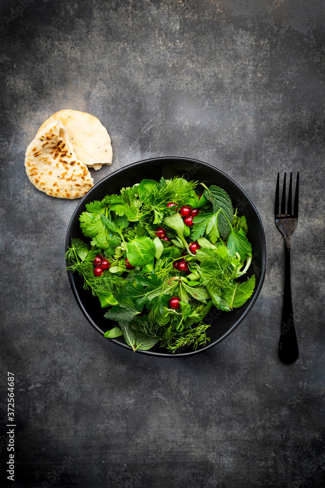 Oriental herb salad (mint, parsley, dill, coriander, lambs lettuce) with currants and pomegranate dressing Oriental herb salad (mint, parsley, dill, coriander, lambs lettuce) with currants and pomegranate dressing
