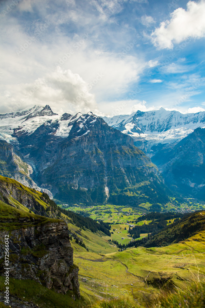 View of the Grindelwald valley in the alps mountains above the village of Grindelwald, Switzerland.