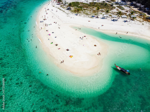Thailand, Satun Province, Ko Lipe, Aerial view of people relaxing on North Point Beach in summer photo