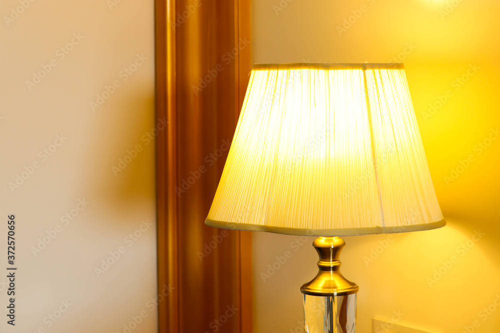 Designer Night Table Lamp WIth Conical Shape Hood And Metal Stand Illuminated With Golden Yellow Light Designer Night Table Lamp WIth Conical Shape Hood And Metal Stand Illuminated With Golden Yellow Light