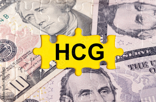 Puzzle with the image of dollars in the center of the inscription -HCG