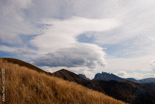 Lenticular clouds over mountains in Bolshoy Tkhach national park