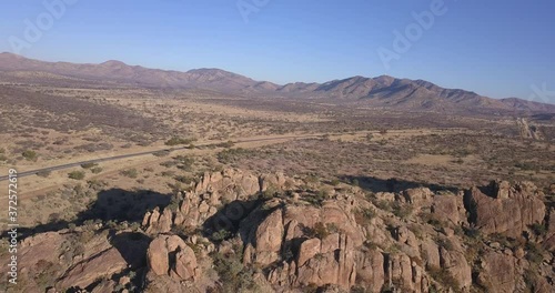 4K aerial drone video of African savanna hills, large red granite boulders range in southern Africa