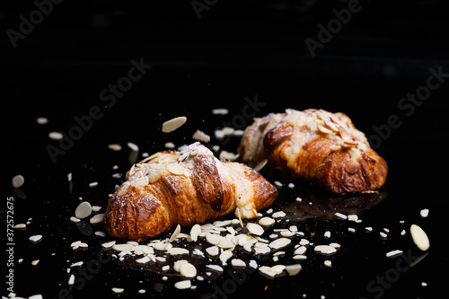 Croissants with chocolate. Homemade pastries  croissants sprinkled with powder and cereals.