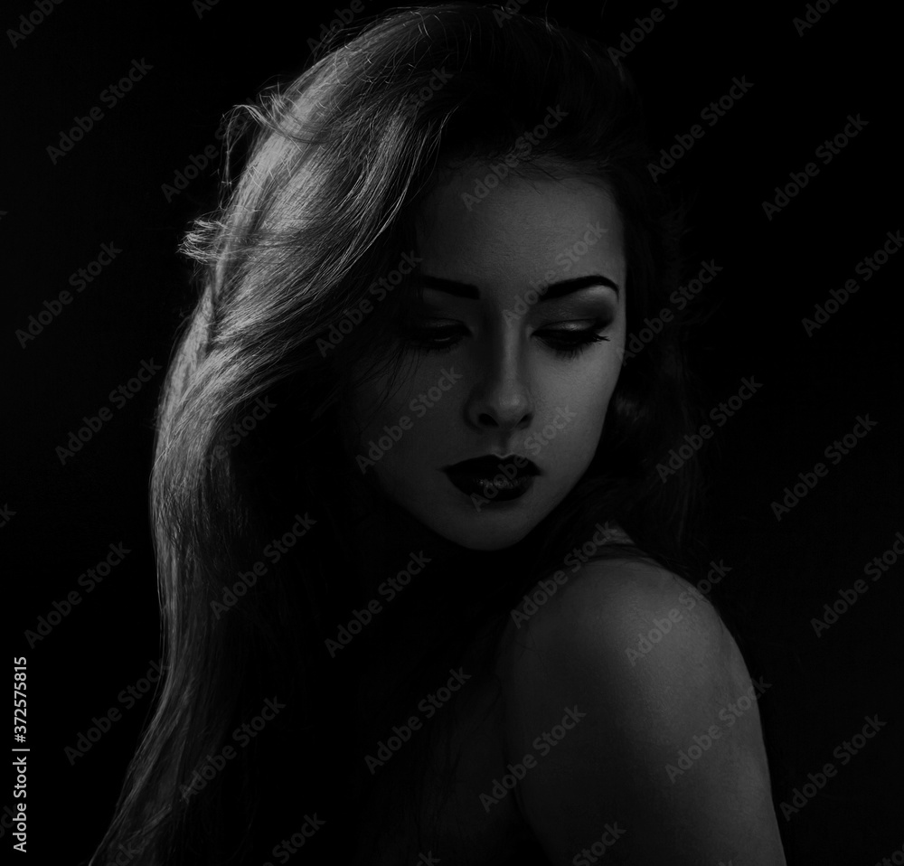 Beautiful makeup calm woman with red lipstick and long hair looking sexy with half shadow on the face. Closeup portrait. Art.Expression portrait. Black and white Beautiful makeup calm woman with red lipstick and long hair looking sexy with half shadow on the face. Closeup portrait. Art.Expression portrait. Black and white