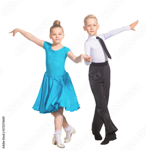 Sports ballroom dancing. Couple of kids, boy and girl  on isolated white background