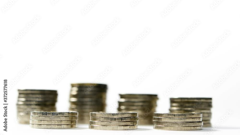 Coins on stack decreasing on white background - stop motion Coins on stack decreasing on white background - stop motion