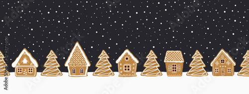 Gingerbread village. Christmas background. Seamless border. Fairytale winter landscape. There are gingerbread houses and fir trees on a dark blue background. Greeting card template. Vector