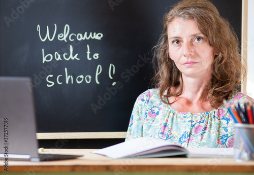 teacher welcoming students back to school