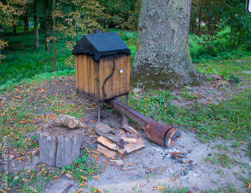 Old homemade smokehouse. antique wooden smokehouse