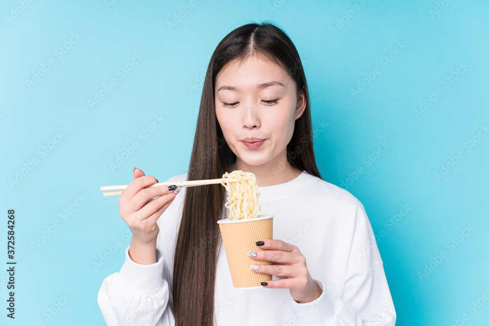 Young japanese woman eating noodles Young japanese woman eating noodles