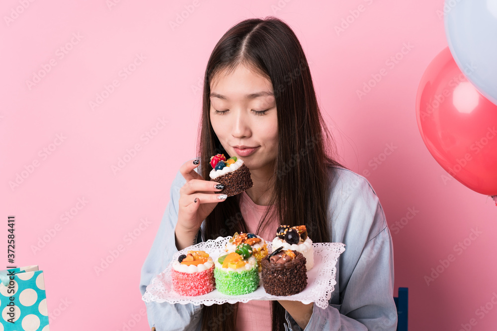 Young japanese woman preparing a birthday party Young japanese woman preparing a birthday party