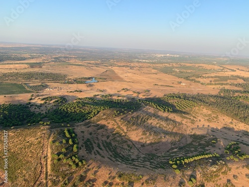 Hot air balloon flight at sunrise, Aerial View over the great Alqueva lake, in Alentejo, Portugal