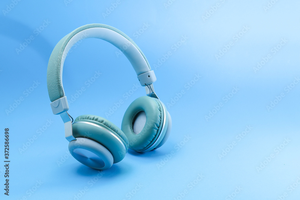 Headphones on blue background Headphones on blue background