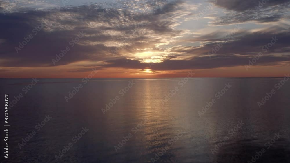 Flying Fast Away From Setting Sun on Horizon in breathtaking Great Lakes Aerial Flying Fast Away From Setting Sun on Horizon in breathtaking Great Lakes Aerial