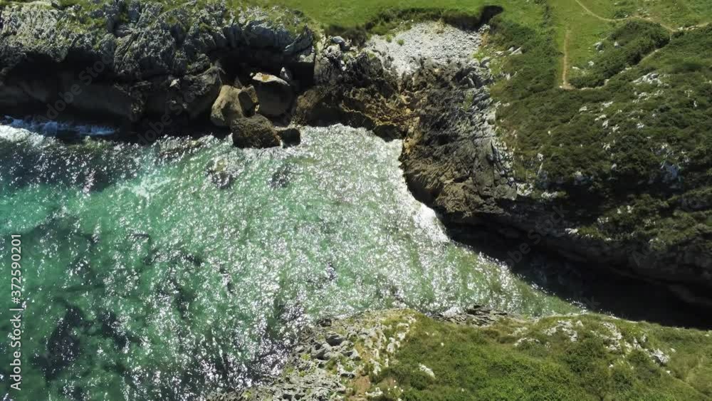 Asturias. Beautiful landscape in the coastal area of Gulpiyuri beach. Spain. Aerial Drone Footage
