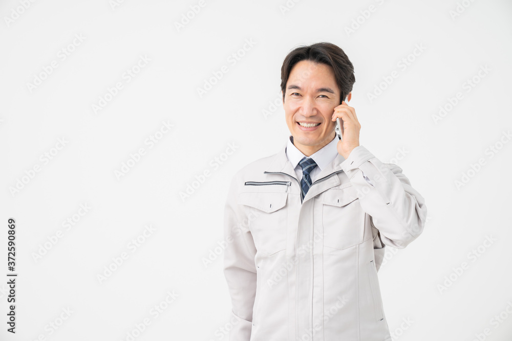 ビジネスマン 作業服 電話 ビジネスマン 作業服 電話
