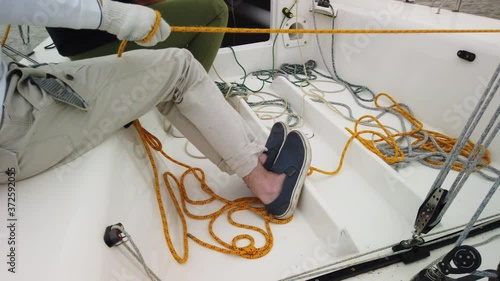 Young boy relaxing on the yacht deck at summer holiday photo