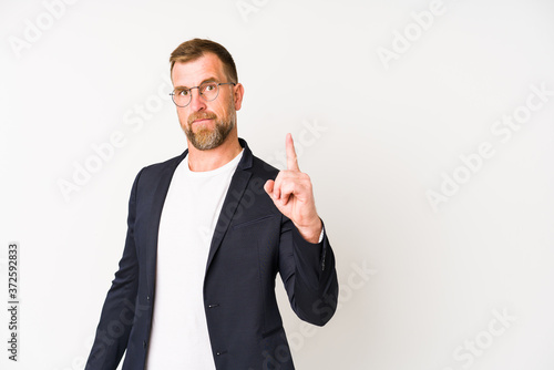 Senior business man isolated on white background showing number one with finger.