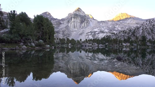 Painted Lady Mountain with Water Reflection at Sunrise photo