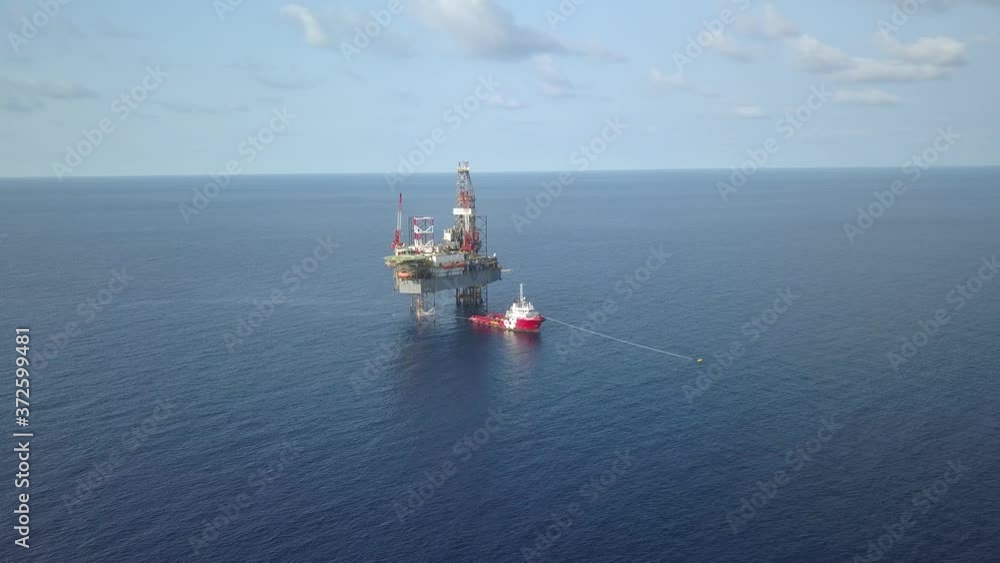Aerial view from a drone of an offshore jack up rig at the offshore location during day time
Aerial view from a drone of an offshore jack up rig at the offshore location during day time