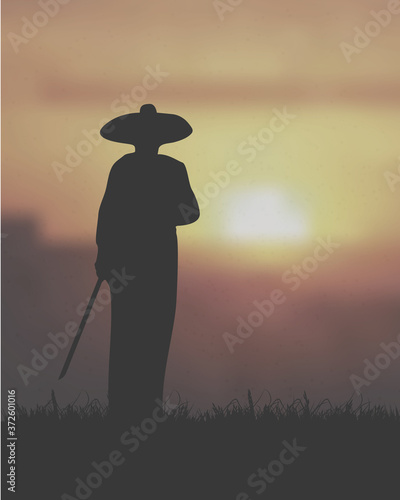 An Asian Monk Warrior Holding The Sword Under The Sunset