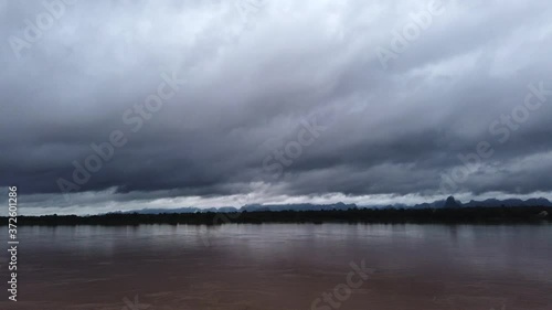 Cloudy day over border Thailand and Laos ,Mekong River are rise by rain and Dam in China release some water to the  river.