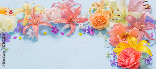 frame of beautiful garden flowers on paper background © Maya Kruchancova