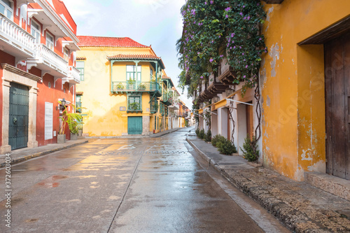Typical street scene in Cartagena, Colombia of a street with old colonial houses on each side © Hector Pertuz