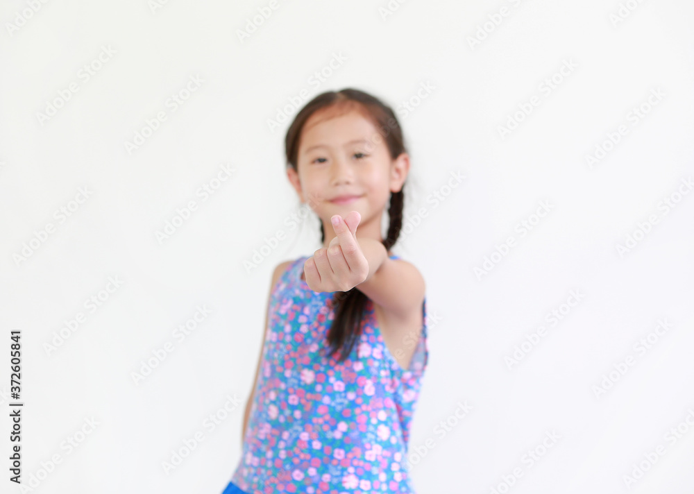 Portrait asian little child girl show finger mini heart symbol sign language isolated on white background. Focus at kid fingers. Portrait asian little child girl show finger mini heart symbol sign language isolated on white background. Focus at kid fingers.