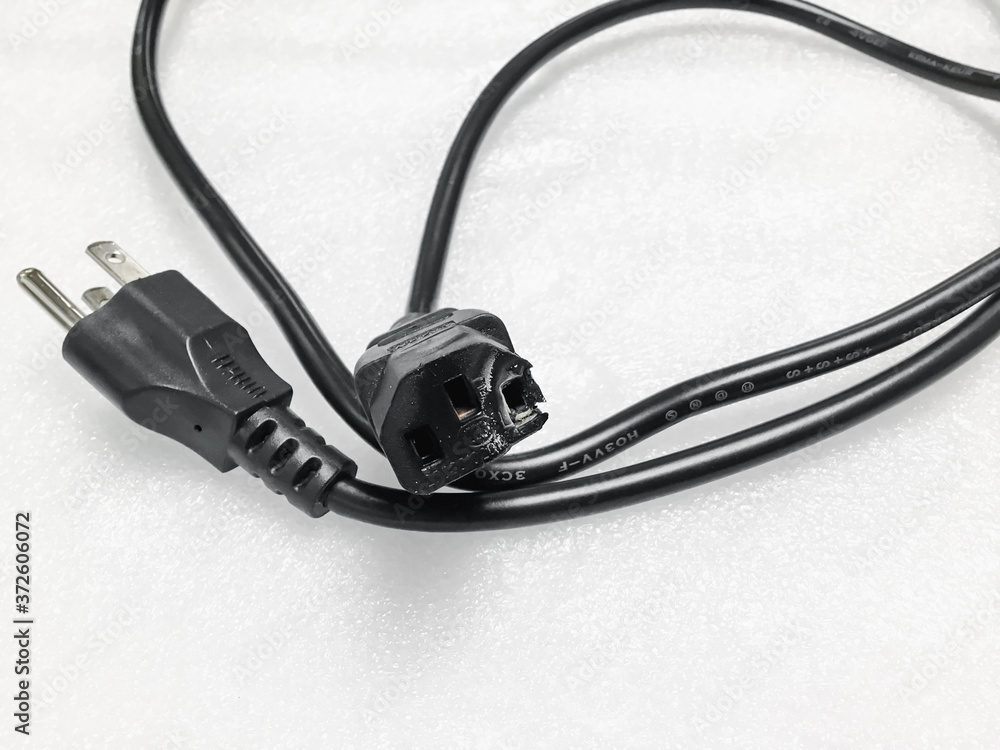 Fotografie The socket is damaged burns and converter isolated on white background