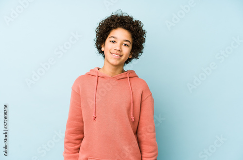 African american little boy isolated happy, smiling and cheerful. photo