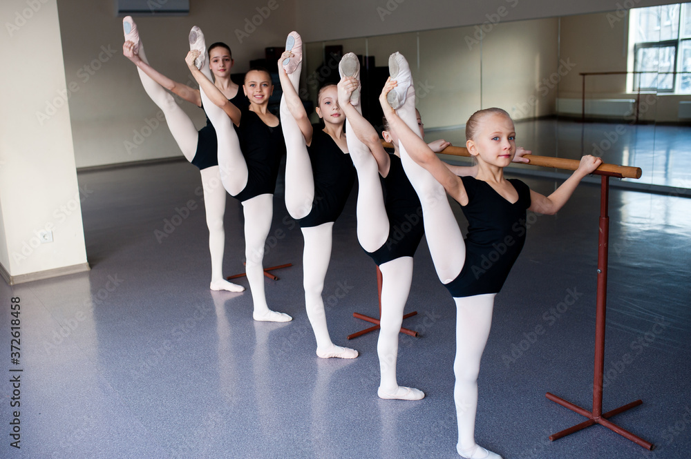 Naklejka premium Stretching, Children in Ballet Dance Class.