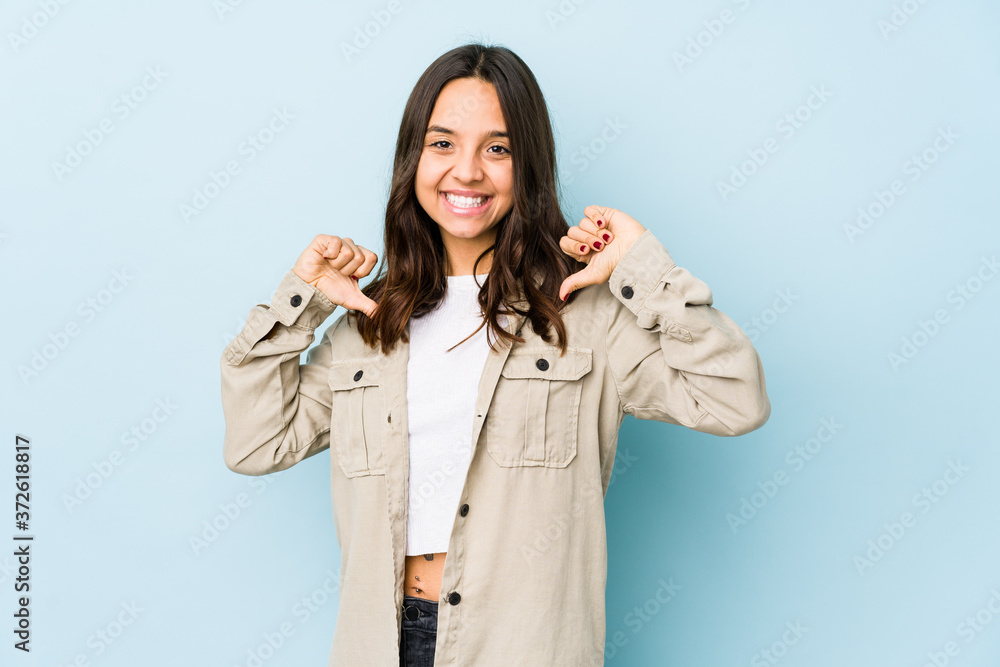 Young mixed race hispanic woman isolated feels proud and self confident, example to follow. Young mixed race hispanic woman isolated feels proud and self confident, example to follow.