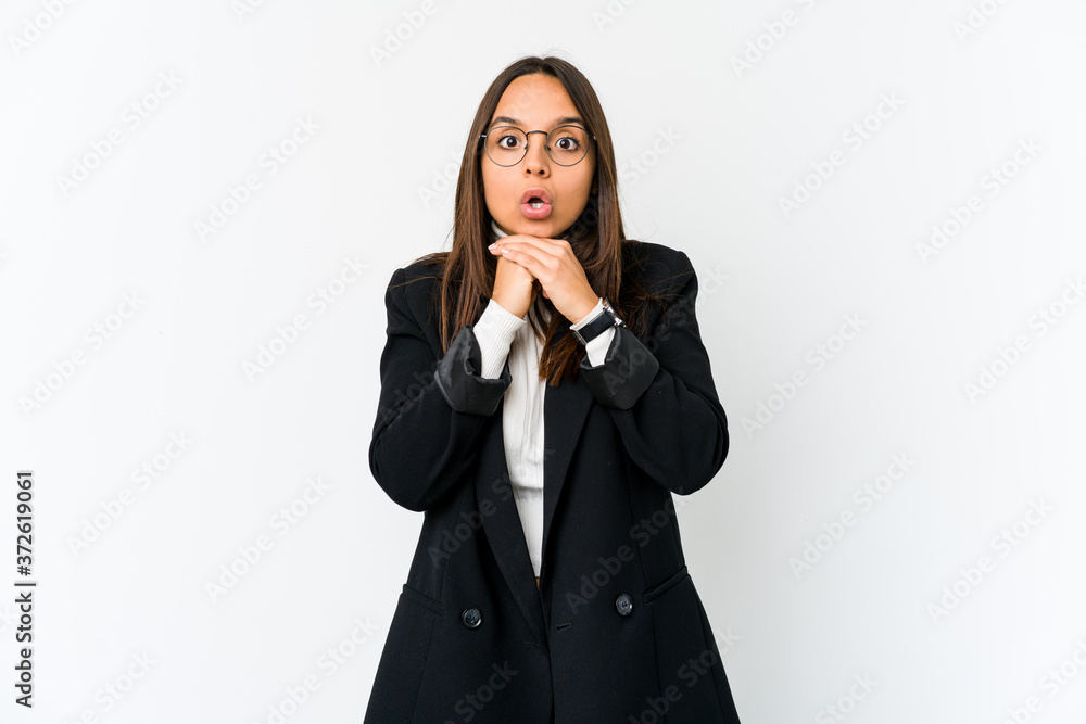 Young mixed race business woman isolated on white background praying for luck, amazed and opening mouth looking to front. Young mixed race business woman isolated on white background praying for luck, amazed and opening mouth looking to front.