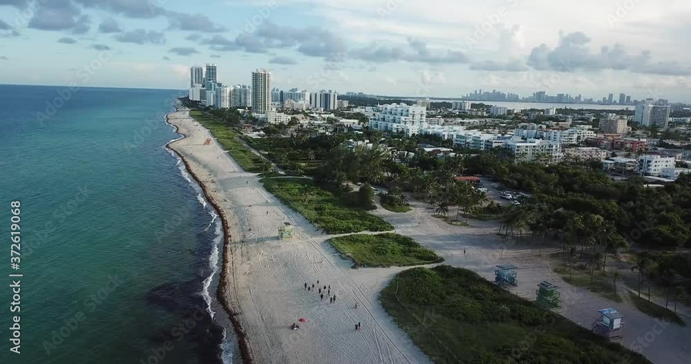 Drone shot of beach and city buildings