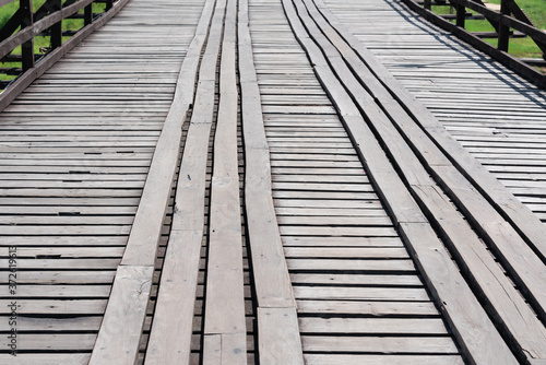 Close up shot on old wooden bridge road © KissShot