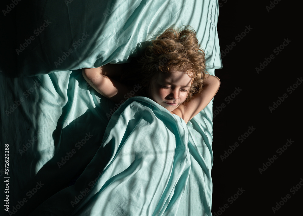 Kid sleeping on bed in bedroom at home. Kid sleeping on bed in bedroom at home.