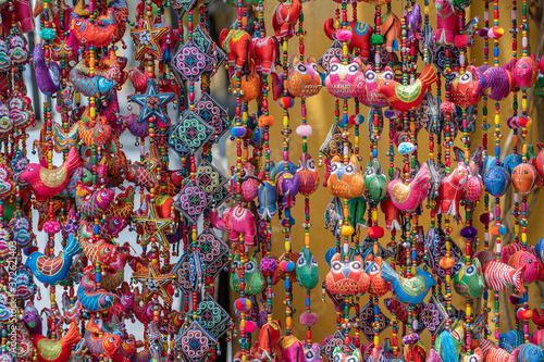 Colorful handmade souvenirs for sale in local street market in Hoi An, Vietnam