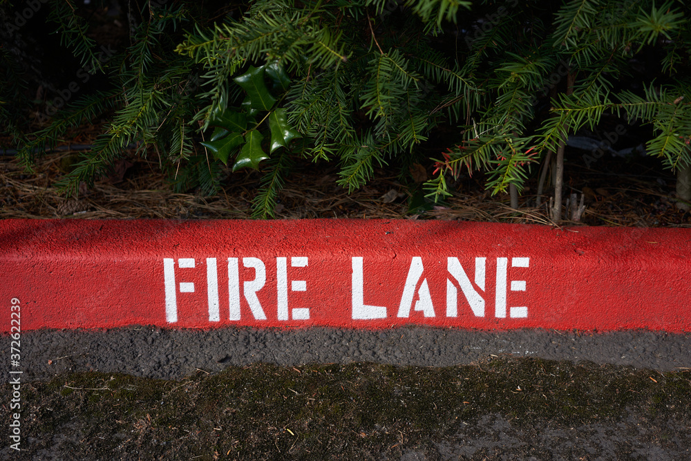 Painted fire lane curb markings. Stock Photo Adobe Stock