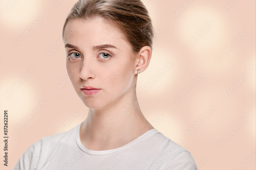 Portrait of young serious girl with perfect smooth skin Portrait of young serious girl with perfect smooth skin