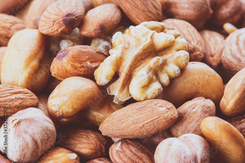 nut mix close-up, macro photo, background image, healthy food concept, top view