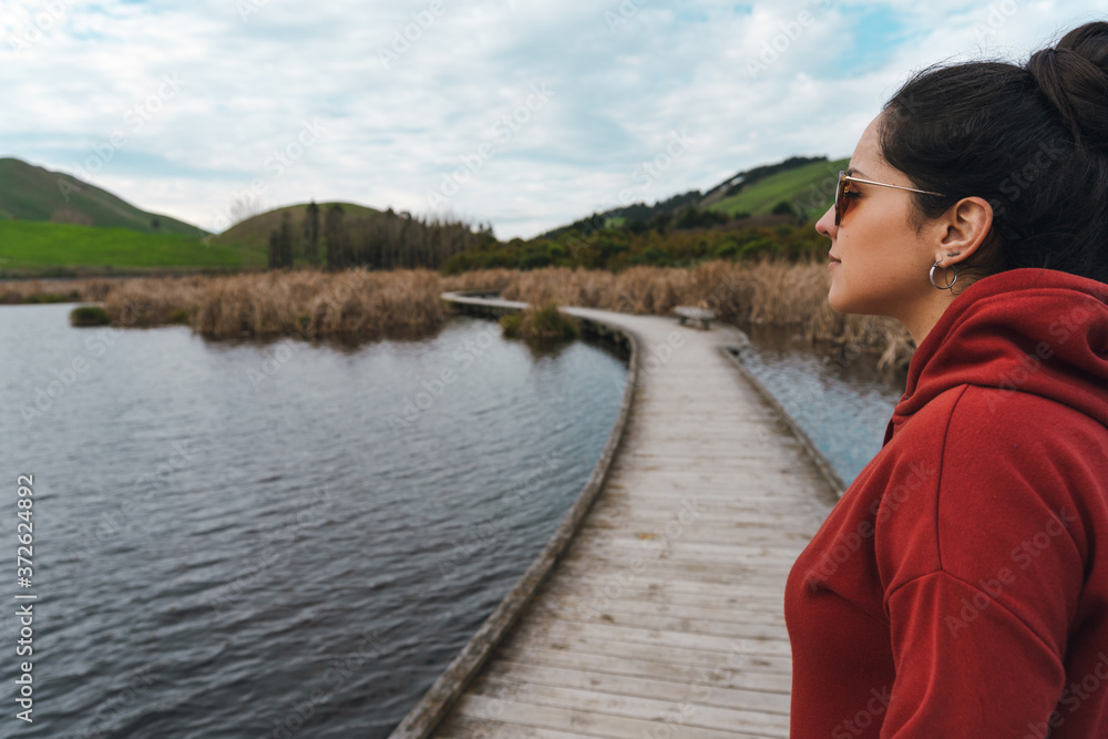 woman wearing hoodie and sunglasses on Peka PEka Wetlands