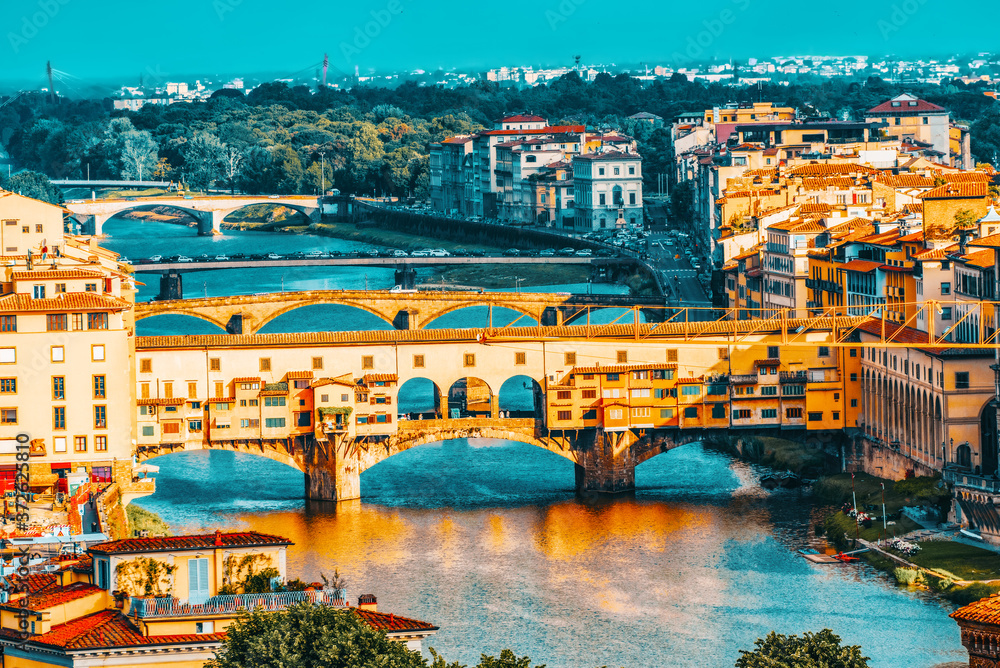 Beautiful landscape above, panorama on historical view of the Florence from  Piazzale Michelangelo point. Ponte Vecchio is a bridge in Florence, located at the narrowest point of the Arno River.