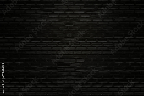 Old black bricks wall texture and background.