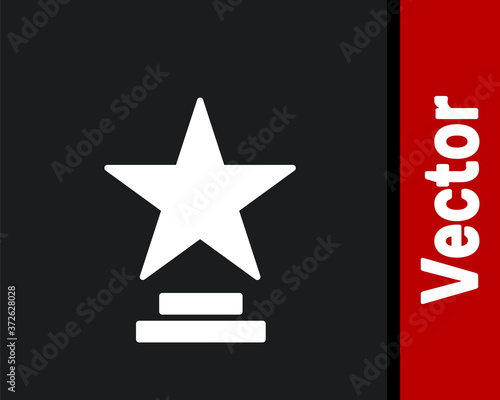 White Movie trophy icon isolated on black background. Academy award icon. Films and cinema symbol. Vector Illustration.