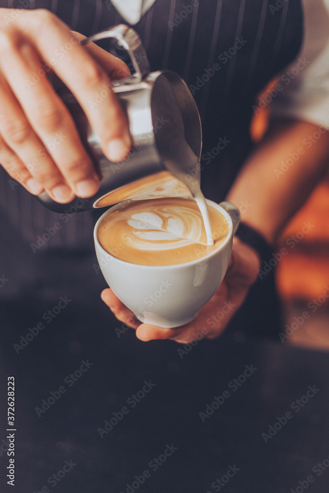 Barista making an ornament for cappuccino Barista making an ornament for cappuccino