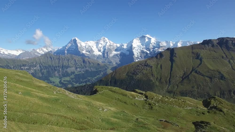 REVERSE AERIAL OF BEAUTIFUL SWISS MOUNTAINS AND TOURISTS ON RIDGE REVERSE AERIAL OF BEAUTIFUL SWISS MOUNTAINS AND TOURISTS ON RIDGE